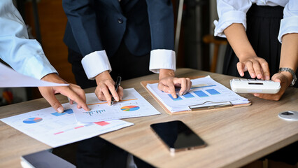 Fototapeta premium A smart business people in the meeting, analyzing financial sales data on the report