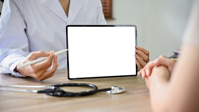close-up image, A professional female doctor showing something on tablet screen