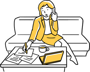 ソファで仕事をする女性