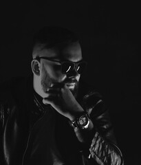 Portrait of bearded man in black leather