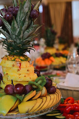 serving food in a restaurant, fruit plate.