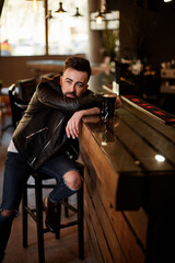 handsome man in jacket at the bar