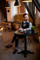 handsome man waiting in a cafe