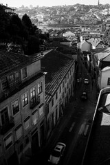 Fototapeta na wymiar View one of the streets in Vila Nova de Gaia, and panorama of the Porto, Portugal. Black and white photo.