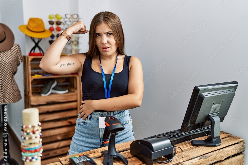 Sticker young brunette woman holding banner with open text at retail shop strong person showing arm muscle, 