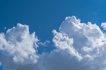 Naklejka na ściany i meble White clouds in the blue sky.