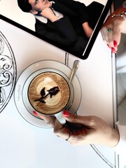 Coffee Delight: Enjoying Cappuccino in a Cozy Moment