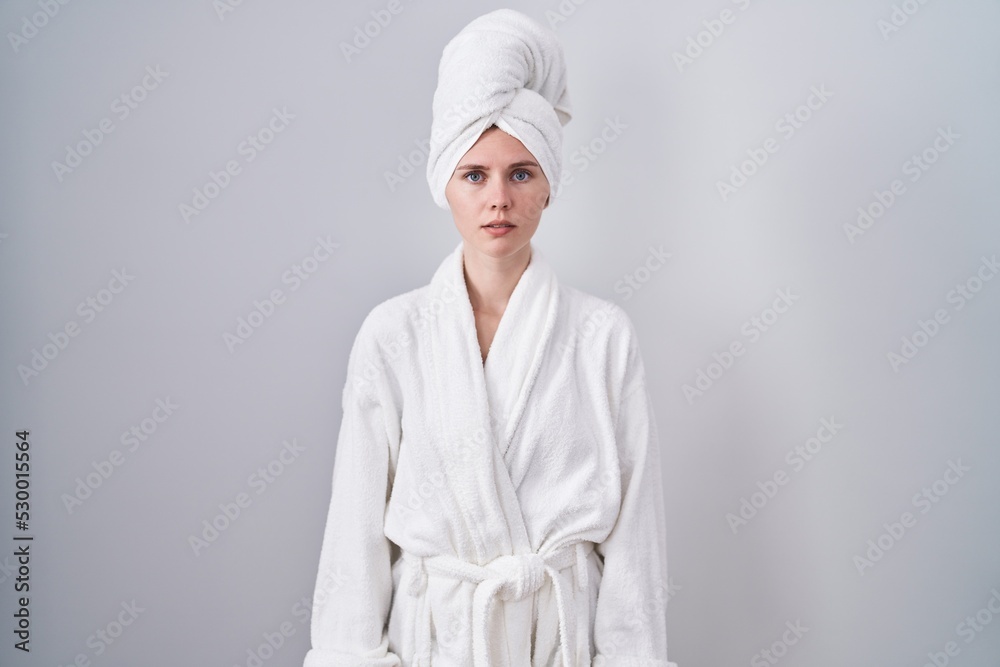 Canvas Prints blonde caucasian woman wearing bathrobe relaxed with serious expression on face. simple and natural 