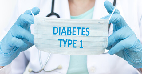 Diabetes Type 1 text on a protective mask in the hands of a doctor, a medical concept