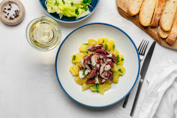  Italian Octopus and Potato Salad, salad and white wine glass. Insalata di polipo e patate. Top...