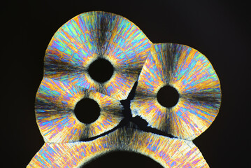 Colorful micro crystals in polarized light. Photo through a microscope.