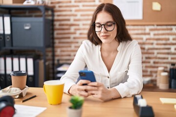 Young woman business worker using smartphone working at office