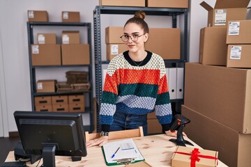 Young woman ecommerce business worker smiling confident standing at office