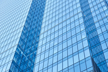 Fototapeta na wymiar Fragment of modern building with glass facade, Exterior of skyscraper, Business office windows in high rise building