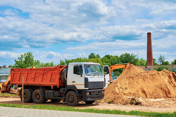 Dumper truck waiting for loading at construction site © Lazy_Bear
