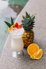 Pineapple and orange in close-up photo