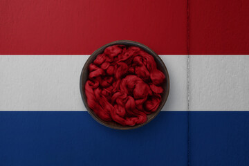 Wooden basket on background in colors of national flag. Photography and marketing digital backdrop. Netherlands