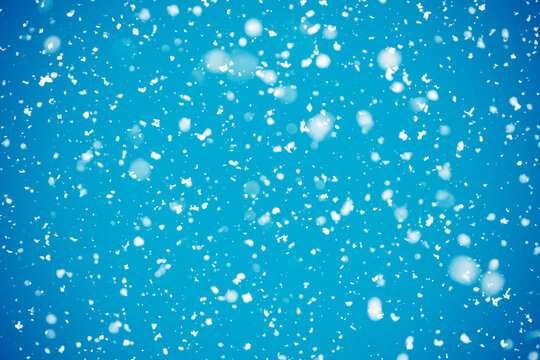 Snowflakes on a blue abstract background.