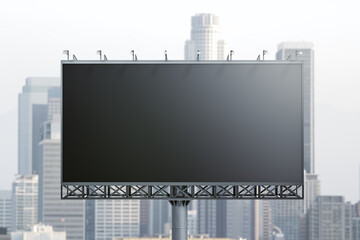 Blank black billboard on cityscape background, front view. Mock up, advertising concept