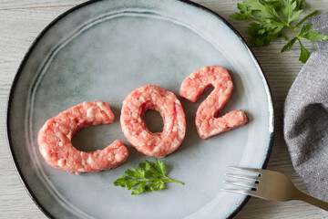 Carbon footprint concept, meat consumption and CO2 emissions, meat on co2-shaped plate, abstraction