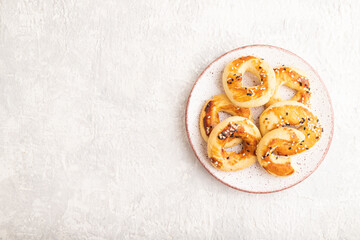 Homemade asian salted cookies on gray concrete, top view, copy space.