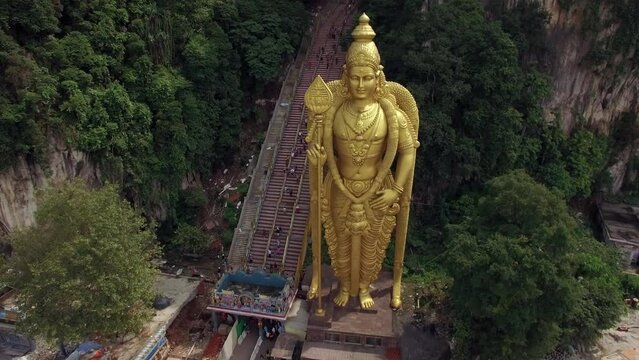 Aerial view of Lord Murugan statue at the entrance of the popular Batu Caves near Kuala Lumpur, Malaysia, one of the most important Hindu shrines outside of India.