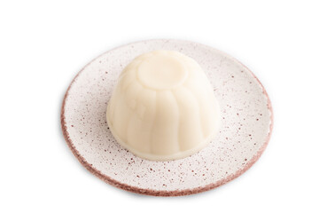 White milk jelly on white, side view.