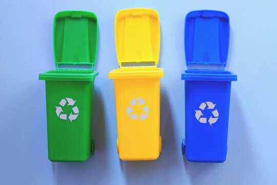 Recycling Garbage Bins. Waste Sorting Concept. Flat lay. Collection of colorful separation recycle bins. Container for sorting waste. Waste types segregation recycling