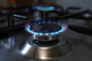 Close-up of a flame of methane gas stove in a domestic kitchen