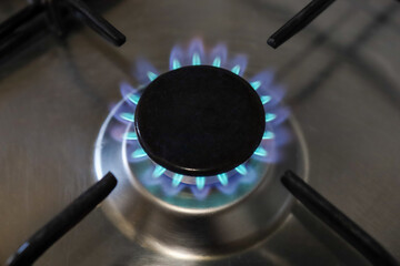 Close-up of a flame of methane gas stove in a domestic kitchen