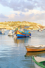 Fototapeta na wymiar traditional colorful fishing boats at Marsaxlokk village Malta