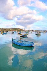 Fototapeta na wymiar traditional fishing boats at Marsaxlokk village Malta