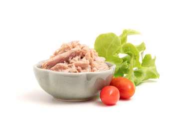 Tuna in spring water isolated on white background.