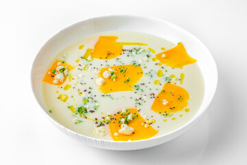 Fragrant first course with cheese and broccoli. Vegetarian dietary cream soup based on baked and fresh vegetables with herbs. Fitness menu. Delivery of prepared food. White background