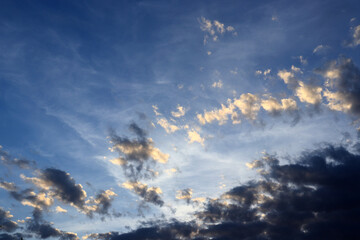 Naklejka na ściany i meble Cloudy sky background. Blue sky, sun and clouds. Copy space.