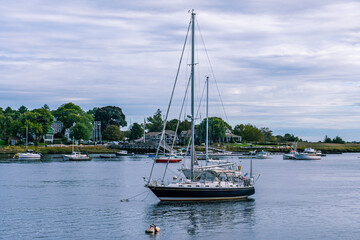 Fototapeta na wymiar Marine yacht with a black hull parked on the river