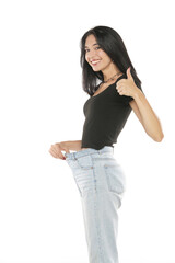 Weight loss happy woman showing thumbs up, isolated on a white background. Slim Body