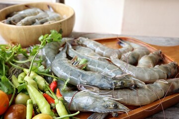 Fresh shrimp raw seafood on wood background