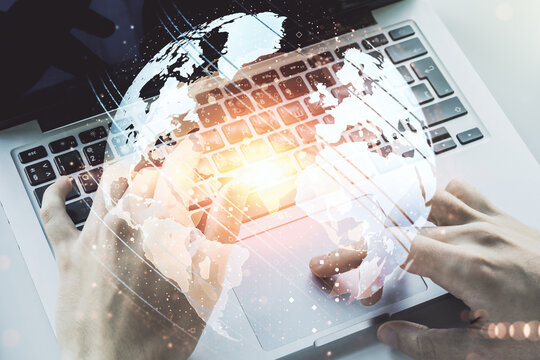 Multi exposure of abstract graphic world map and hands typing on computer keyboard on background, big data and networking concept