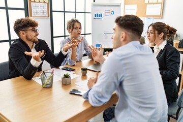 Group of young business workers working at the office.