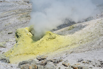 steaminf fumarola in a solfataric field on a slope of the volcano