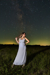 Fototapeta na wymiar Woman with Milky Way in the background