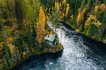Aerial view of fall woods with blue river.  Oulanka National Park, Finland.