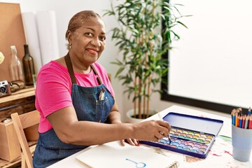 Senior african american woman smiling confident drawing at art studio