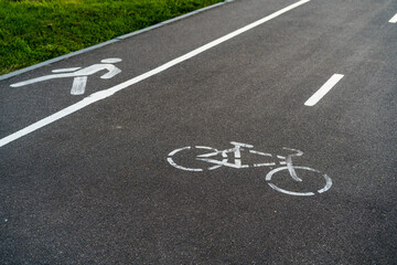 bicycle path, bicycle and running track, pedestrian sign on asphalt