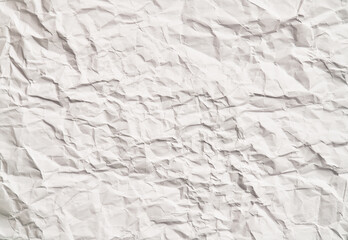 White crumpled paper texture with wrinkles. Damaged and torn sheet