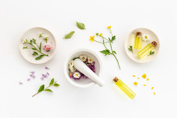 Herbal apothecary with wild flowers and essential oil