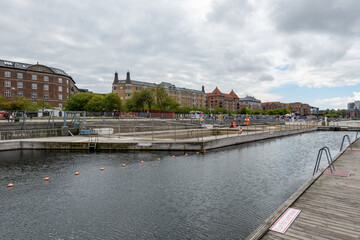 Fototapeta na wymiar Copenhagen Denmark The Islands brygge outdoor swimming pool in the Copenhagen harbor.