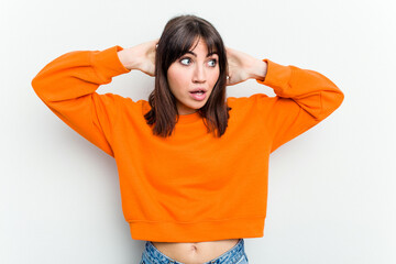 Young caucasian woman isolated on white background screaming, very excited, passionate, satisfied...