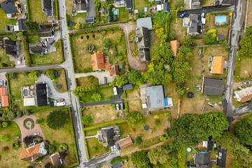 Sweden, Knislinge – September 10, 2022: Aerial view of a little village, golf course, green field. Prive houses. 